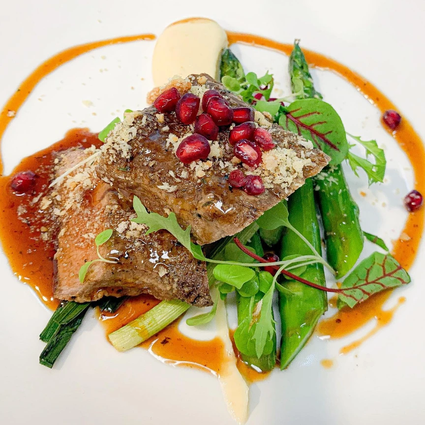Riverina lamb back strap, charred leek, celeriac purée, macadamia crumb, pomegranat